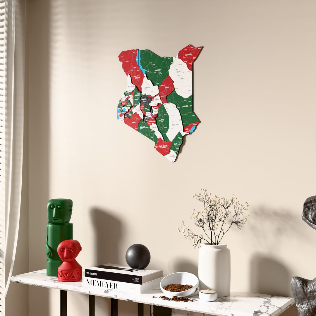 Flag colored Kenya wooden wall map beside a sheer curtain, angled view