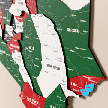 Close-up of the Flag colored Kenya wooden wall map with layered regions and printed names