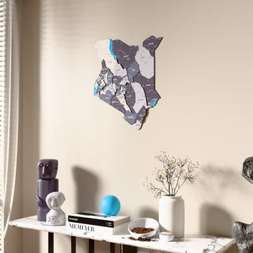 Nimbus Kenya wooden wall map beside a sheer curtain, angled view