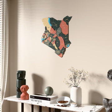 Sage Kenya wooden wall map beside a sheer curtain, angled view