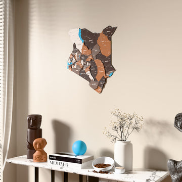 Soil Kenya wooden wall map beside a sheer curtain, angled view