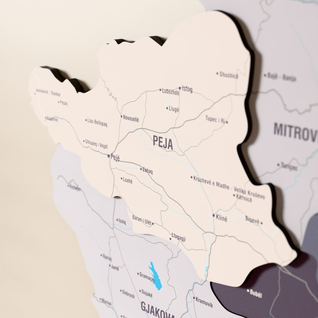 Close-up of the Nimbus Kosovo wooden wall map with layered regions and printed names