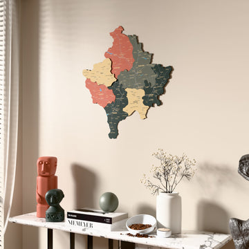 Sage Kosovo wooden wall map beside a sheer curtain, angled view