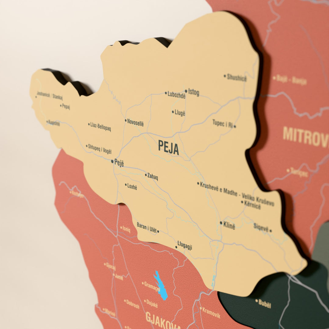 Close-up of the Sage Kosovo wooden wall map with layered regions and printed names