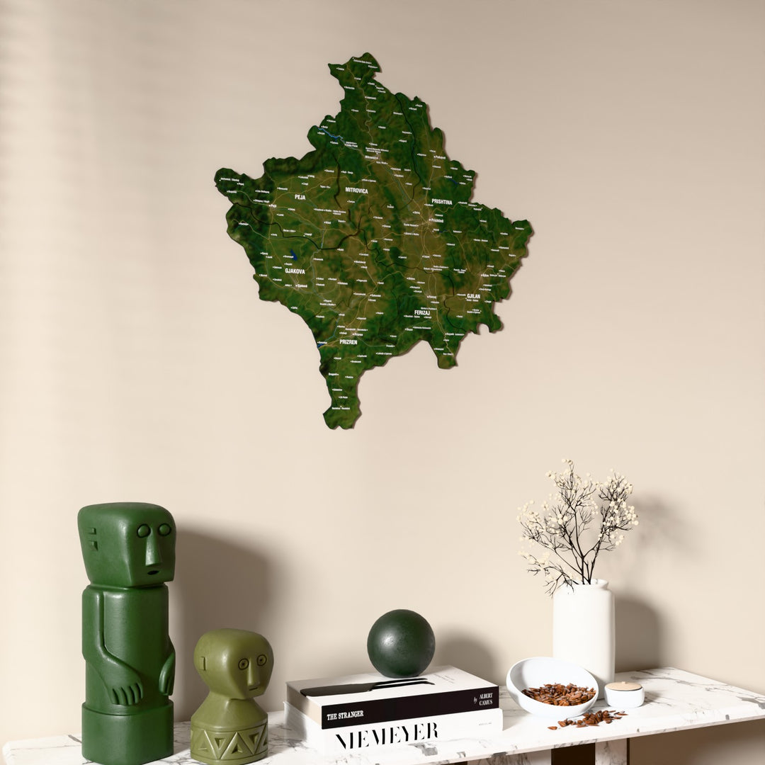 Satellite Kosovo wooden wall map on a beige wall above a console with figurines