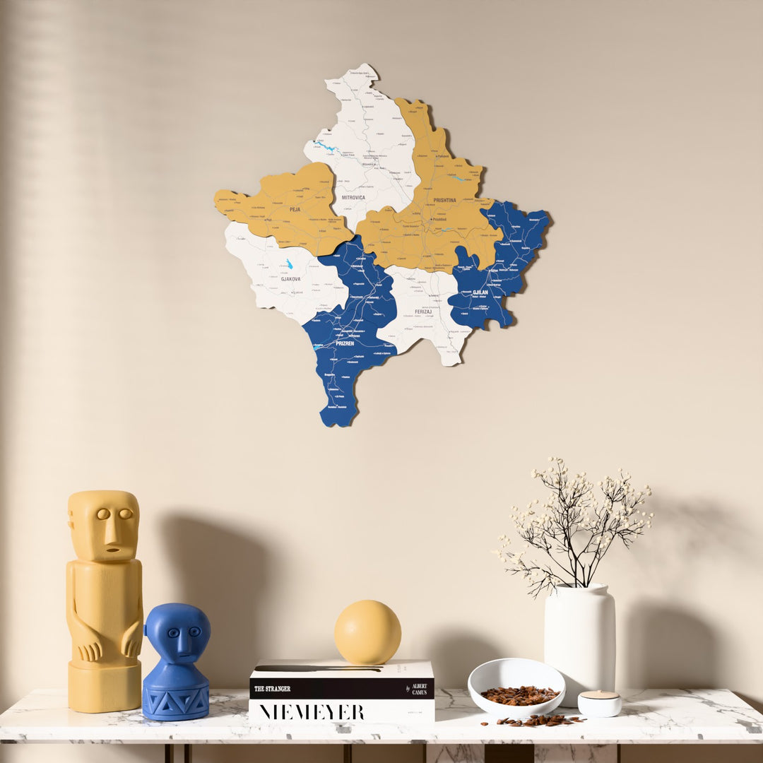 Flag colored Kosovo wooden wall map above a marble console, front view
