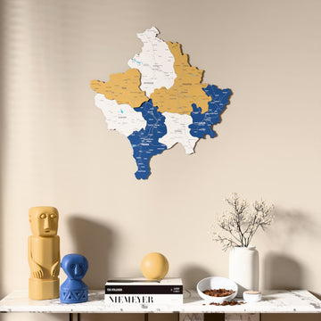 Flag colored Kosovo wooden wall map above a marble console, front view