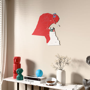Flag colored Kuwait wooden wall map beside a sheer curtain, angled view
