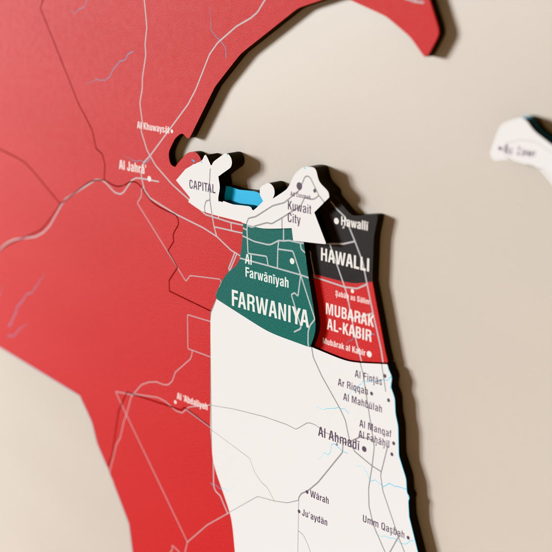 Close-up of the Flag colored Kuwait wooden wall map with layered regions and printed names