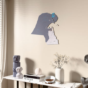 Nimbus Kuwait wooden wall map beside a sheer curtain, angled view