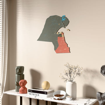 Sage Kuwait wooden wall map beside a sheer curtain, angled view