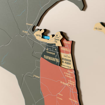 Close-up of the Sage Kuwait wooden wall map with layered regions and printed names