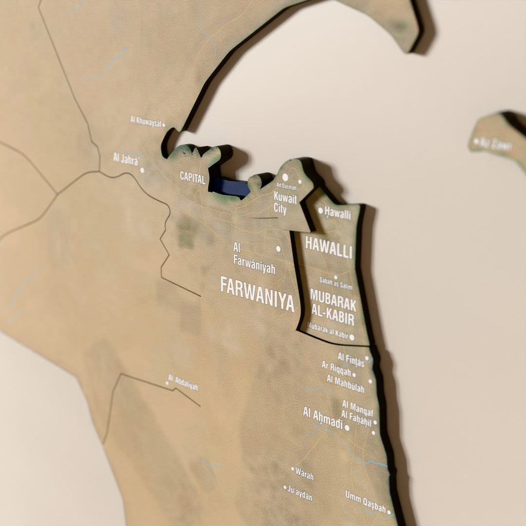 Close-up of the Satellite Kuwait wooden wall map with layered regions and printed names