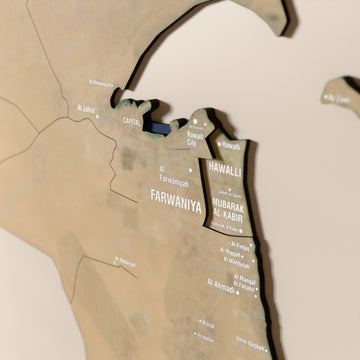 Close-up of the Satellite Kuwait wooden wall map with layered regions and printed names