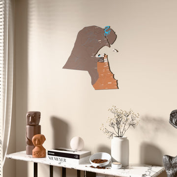 Soil Kuwait wooden wall map beside a sheer curtain, angled view