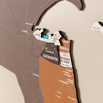 Close-up of the Soil Kuwait wooden wall map with layered regions and printed names