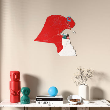Flag colored Kuwait wooden wall map above a marble console, front view
