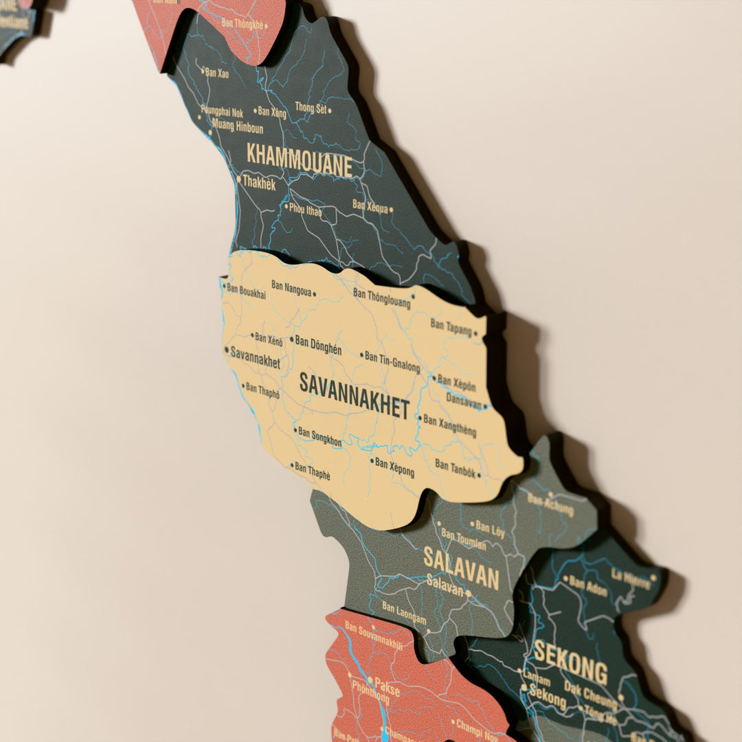 Close-up of the Sage Laos wooden wall map with layered regions and printed names