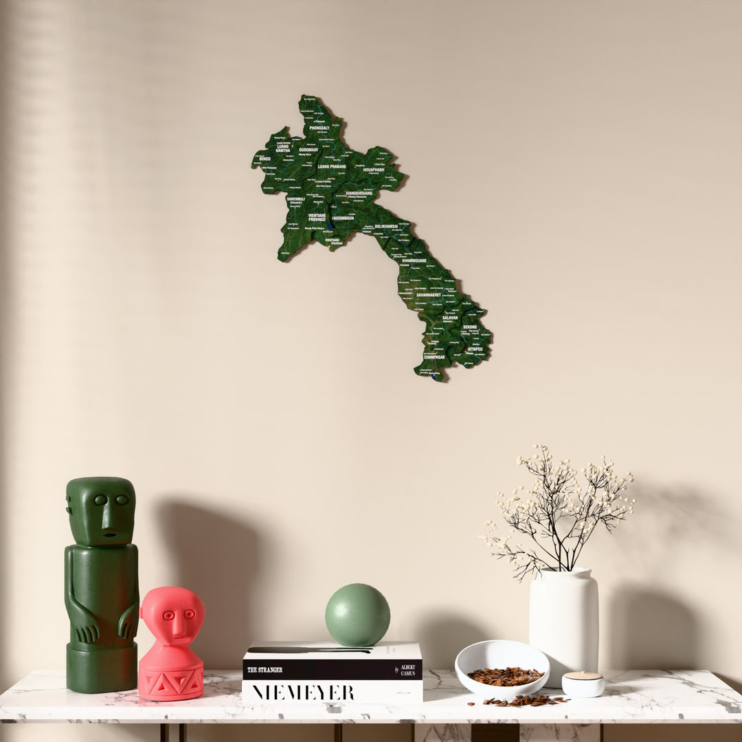 Satellite Laos wooden wall map above a marble console, front view