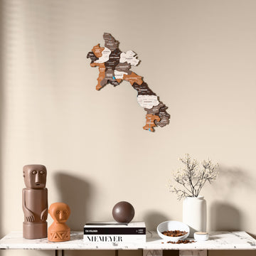 Soil Laos wooden wall map above a marble console, front view