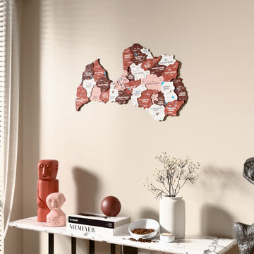 Flag colored Latvia wooden wall map beside a sheer curtain, angled view