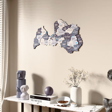 Nimbus Latvia wooden wall map beside a sheer curtain, angled view