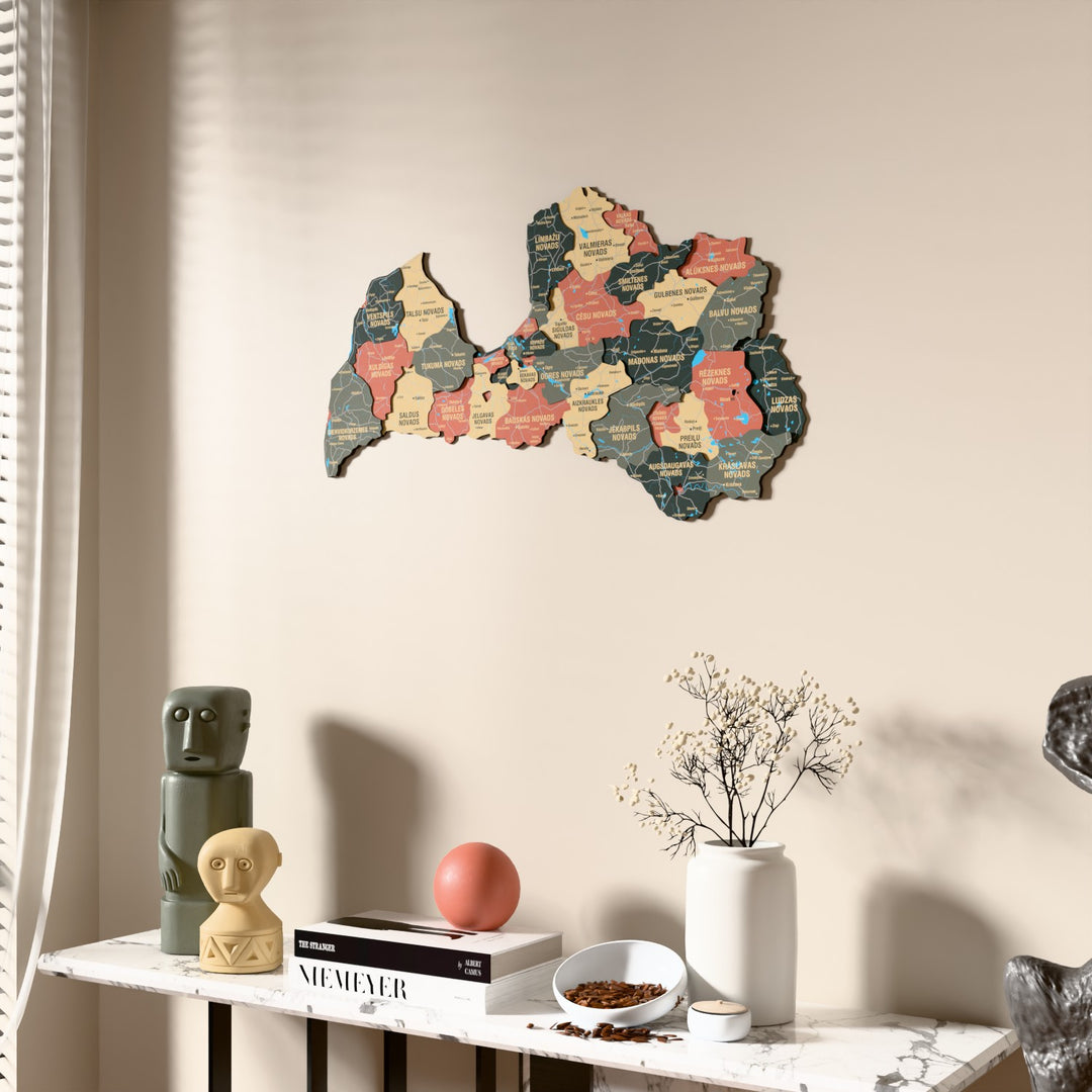Sage Latvia wooden wall map beside a sheer curtain, angled view