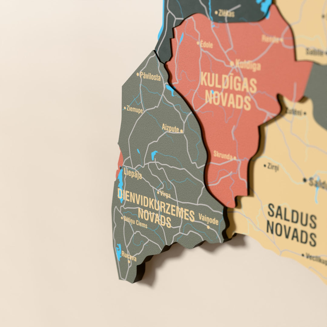 Close-up of the Sage Latvia wooden wall map with layered regions and printed names