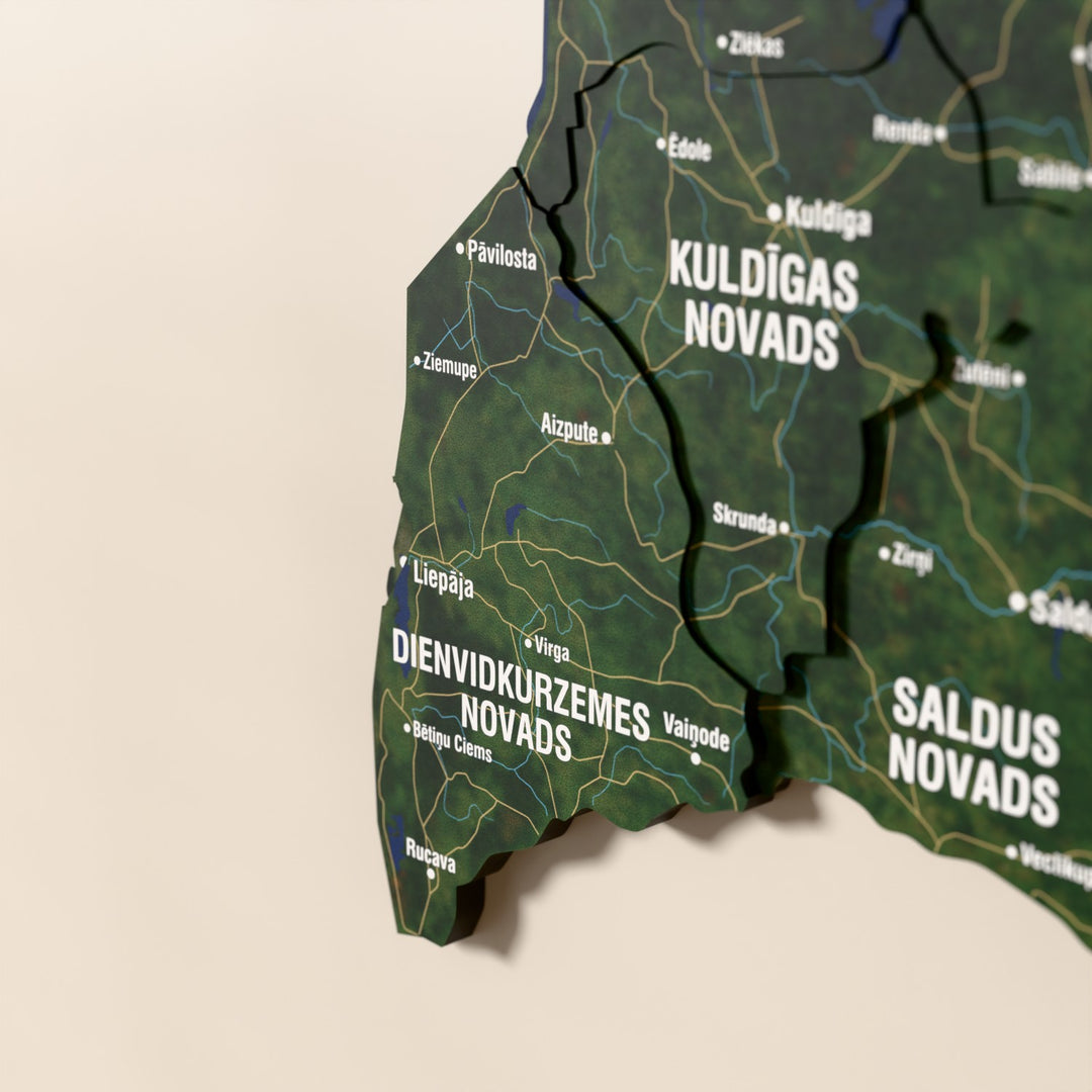 Close-up of the Satellite Latvia wooden wall map with layered regions and printed names