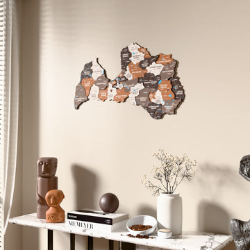 Soil Latvia wooden wall map beside a sheer curtain, angled view