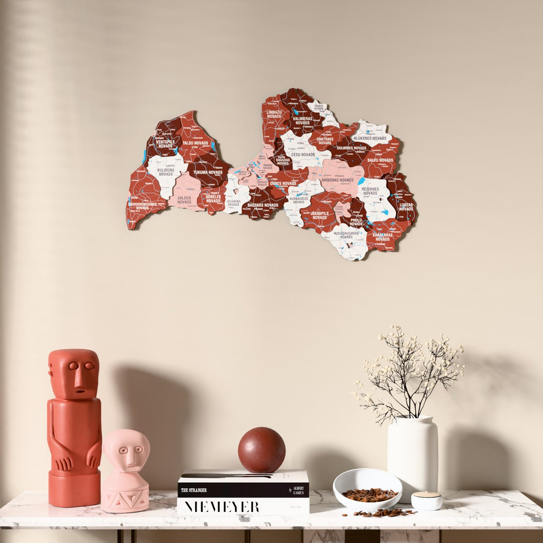 Flag colored Latvia wooden wall map above a marble console, front view