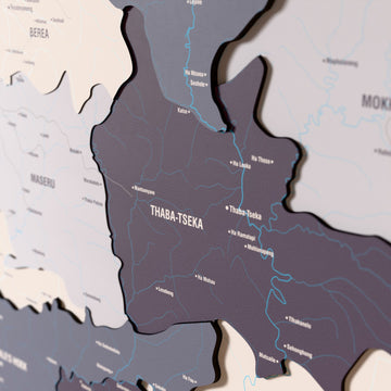 Close-up of the Nimbus Lesotho wooden wall map with layered regions and printed names