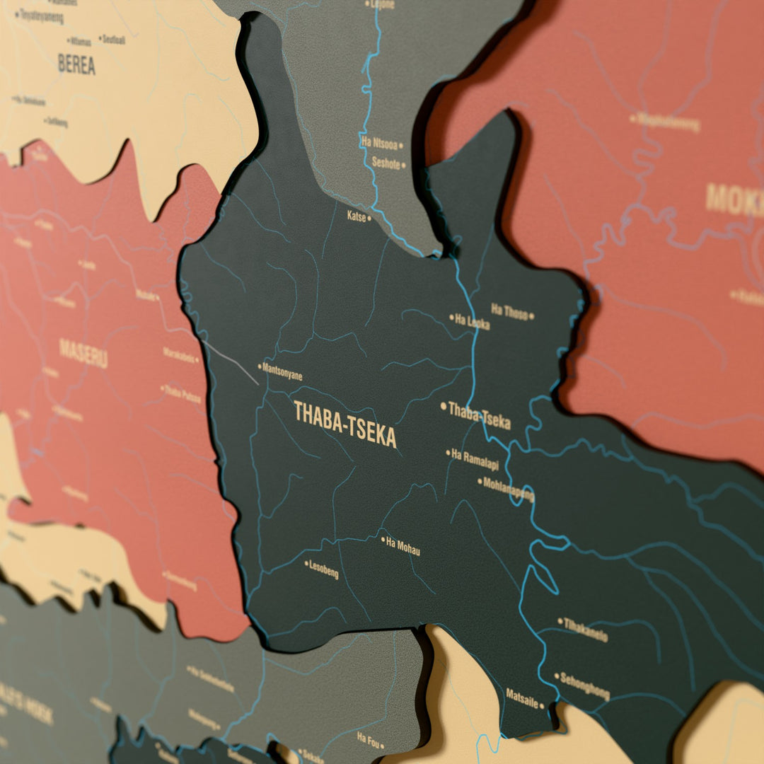 Close-up of the Sage Lesotho wooden wall map with layered regions and printed names