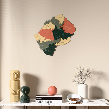 Sage Lesotho wooden wall map above a marble console, front view