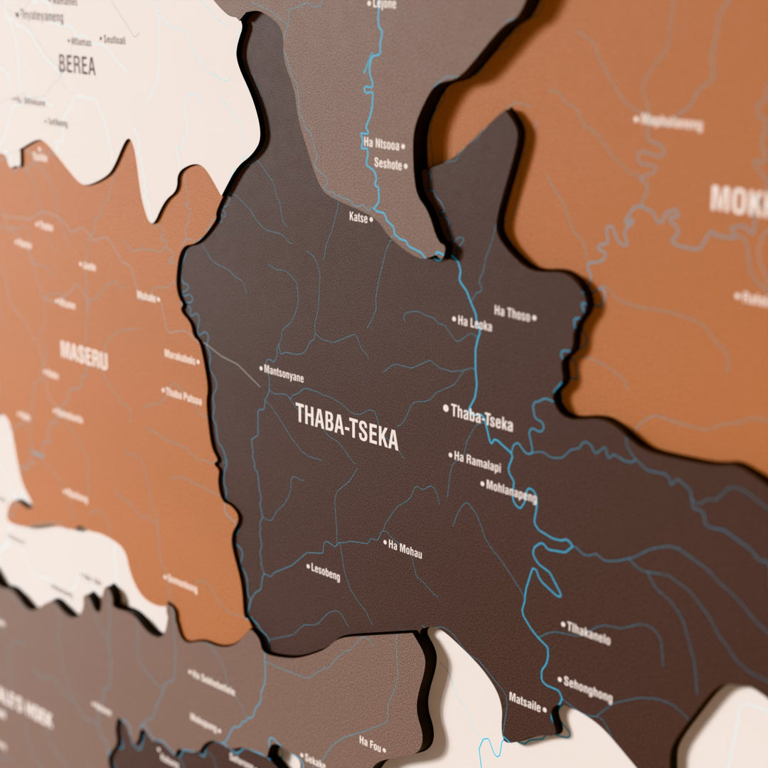 Close-up of the Soil Lesotho wooden wall map with layered regions and printed names