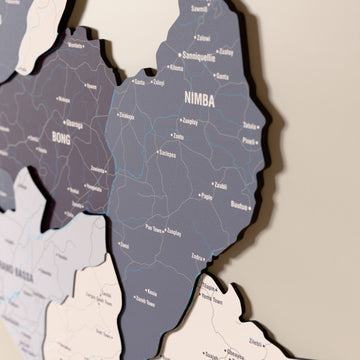 Close-up of the Nimbus Liberia wooden wall map with layered regions and printed names