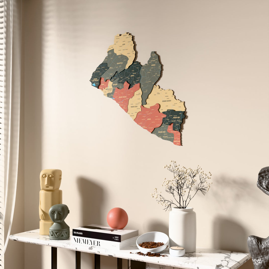 Sage Liberia wooden wall map beside a sheer curtain, angled view