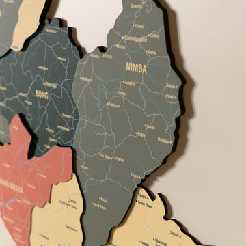 Close-up of the Sage Liberia wooden wall map with layered regions and printed names