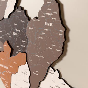 Close-up of the Soil Liberia wooden wall map with layered regions and printed names