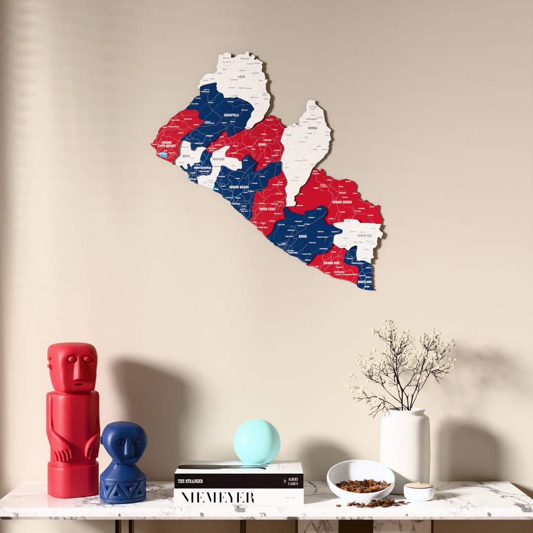 Flag colored Liberia wooden wall map above a marble console, front view