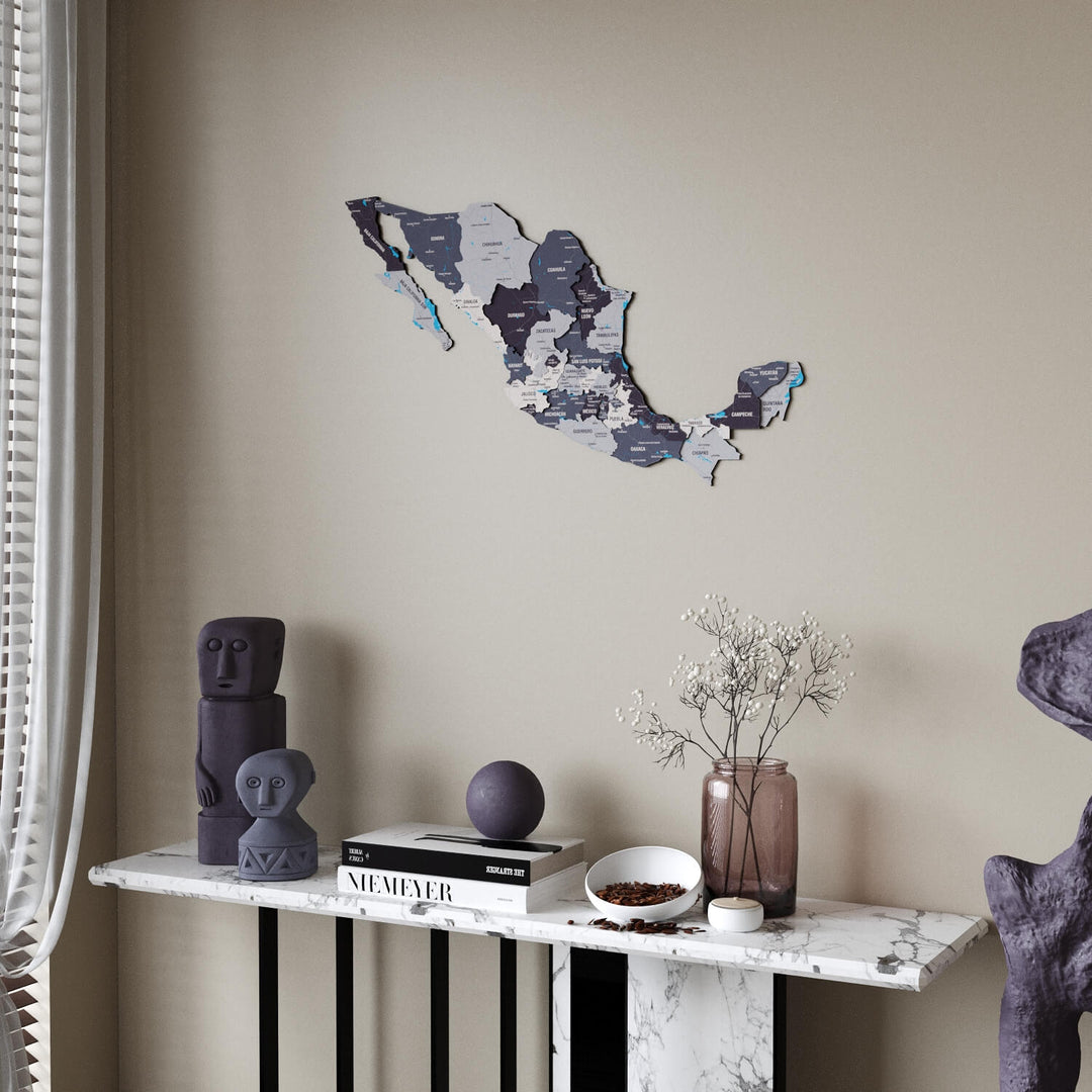 Nimbus Mexico wooden wall map in slate gray and purple tones above a marble console table, sheer curtain at the left