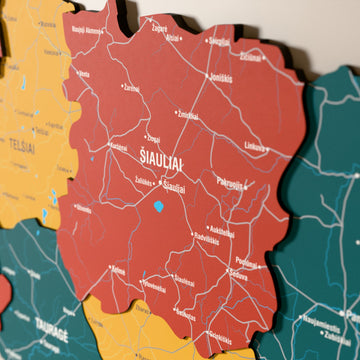 Close-up of the Flag colored Lithuania wooden wall map with layered regions and printed names