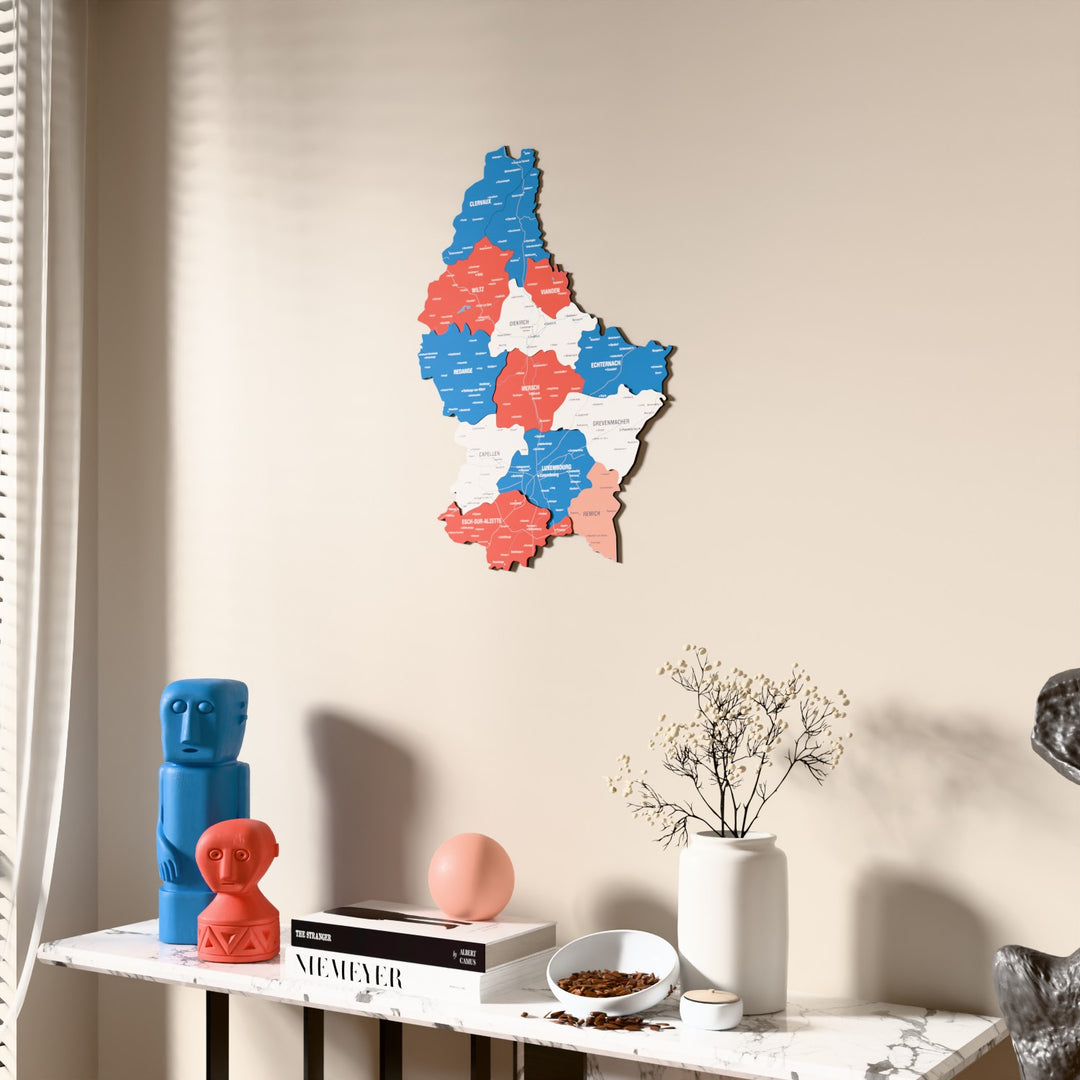 Flag colored Luxembourg wooden wall map beside a sheer curtain, angled view