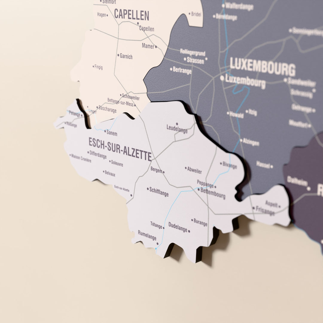 Close-up of the Nimbus Luxembourg wooden wall map with layered regions and printed names