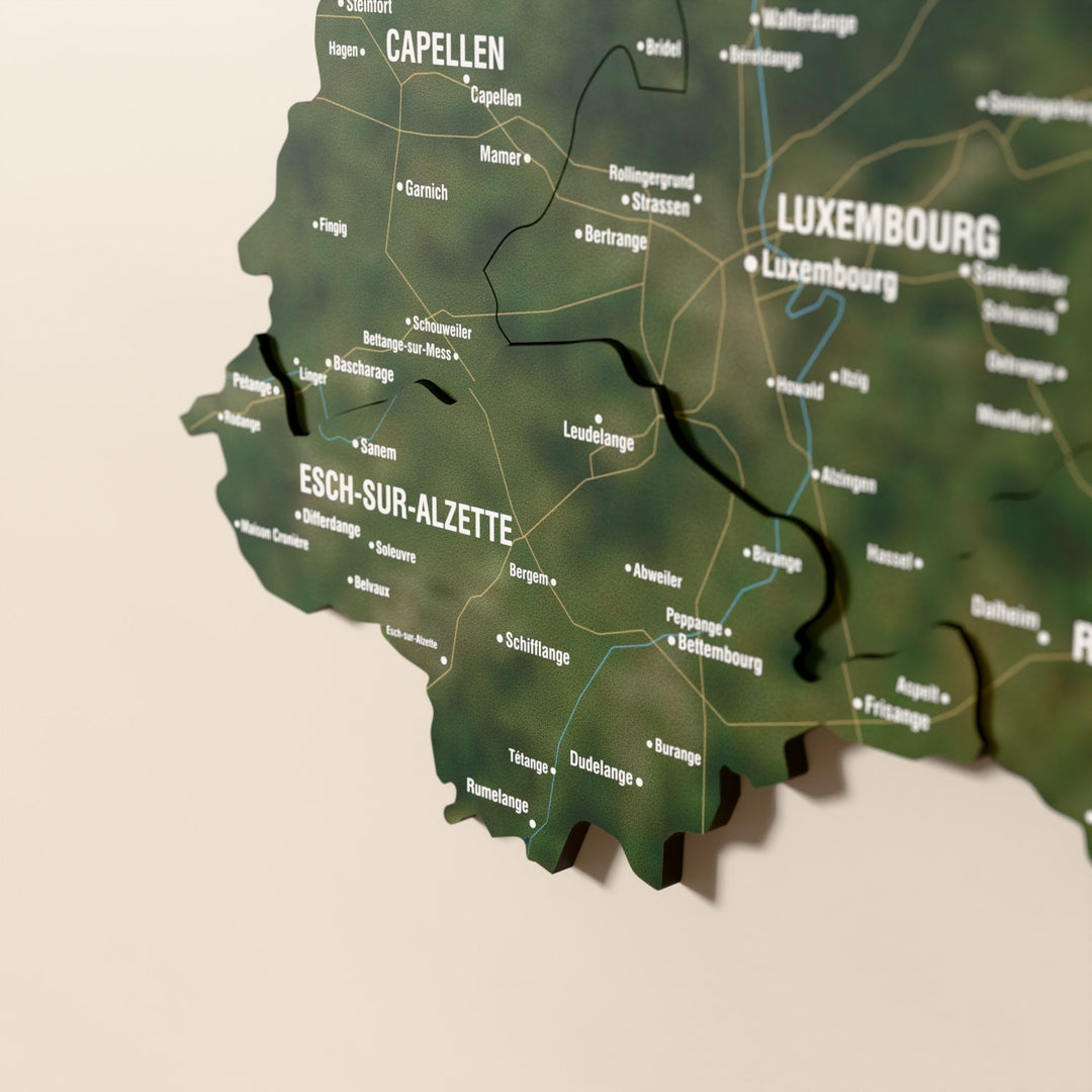 Close-up of the Satellite Luxembourg wooden wall map with layered regions and printed names