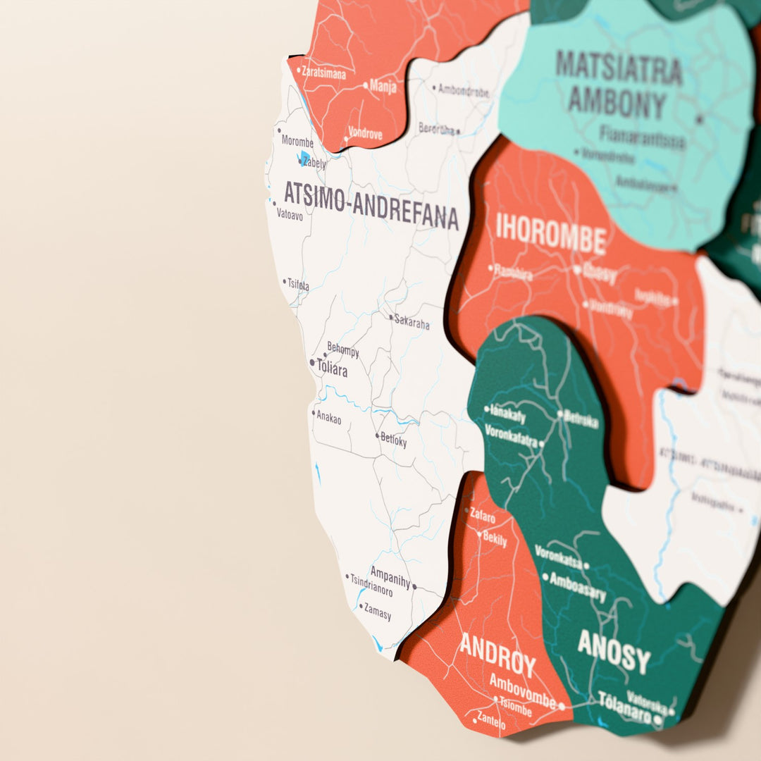 Close-up of the Flag colored Madagascar wooden wall map with layered regions and printed names