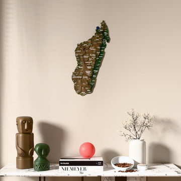 Satellite Madagascar wooden wall map above a marble console, front view