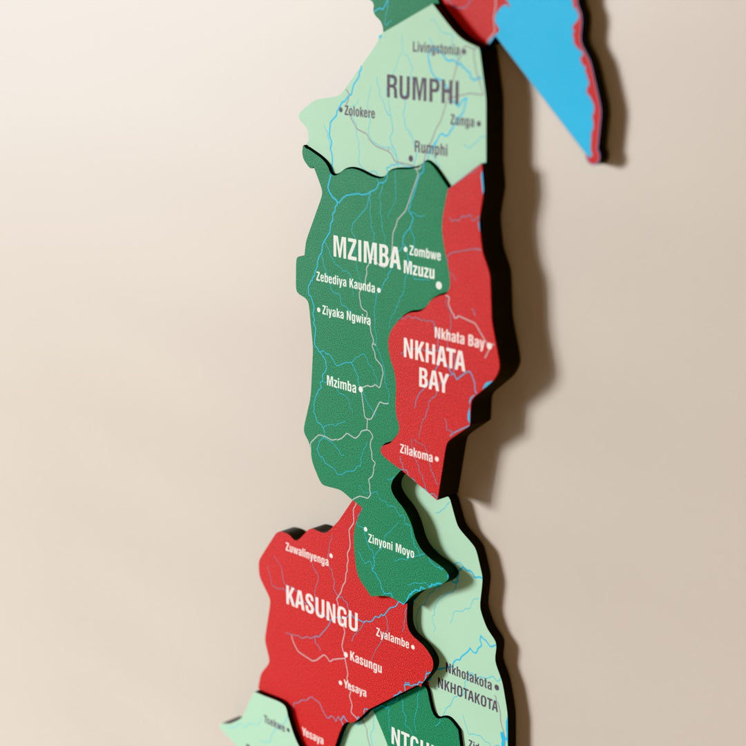 Close-up of the Flag colored Malawi wooden wall map with layered regions and printed names