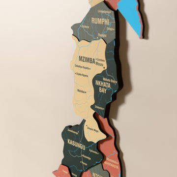 Close-up of the Sage Malawi wooden wall map with layered regions and printed names
