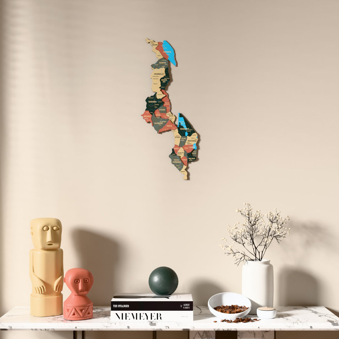 Sage Malawi wooden wall map above a marble console, front view